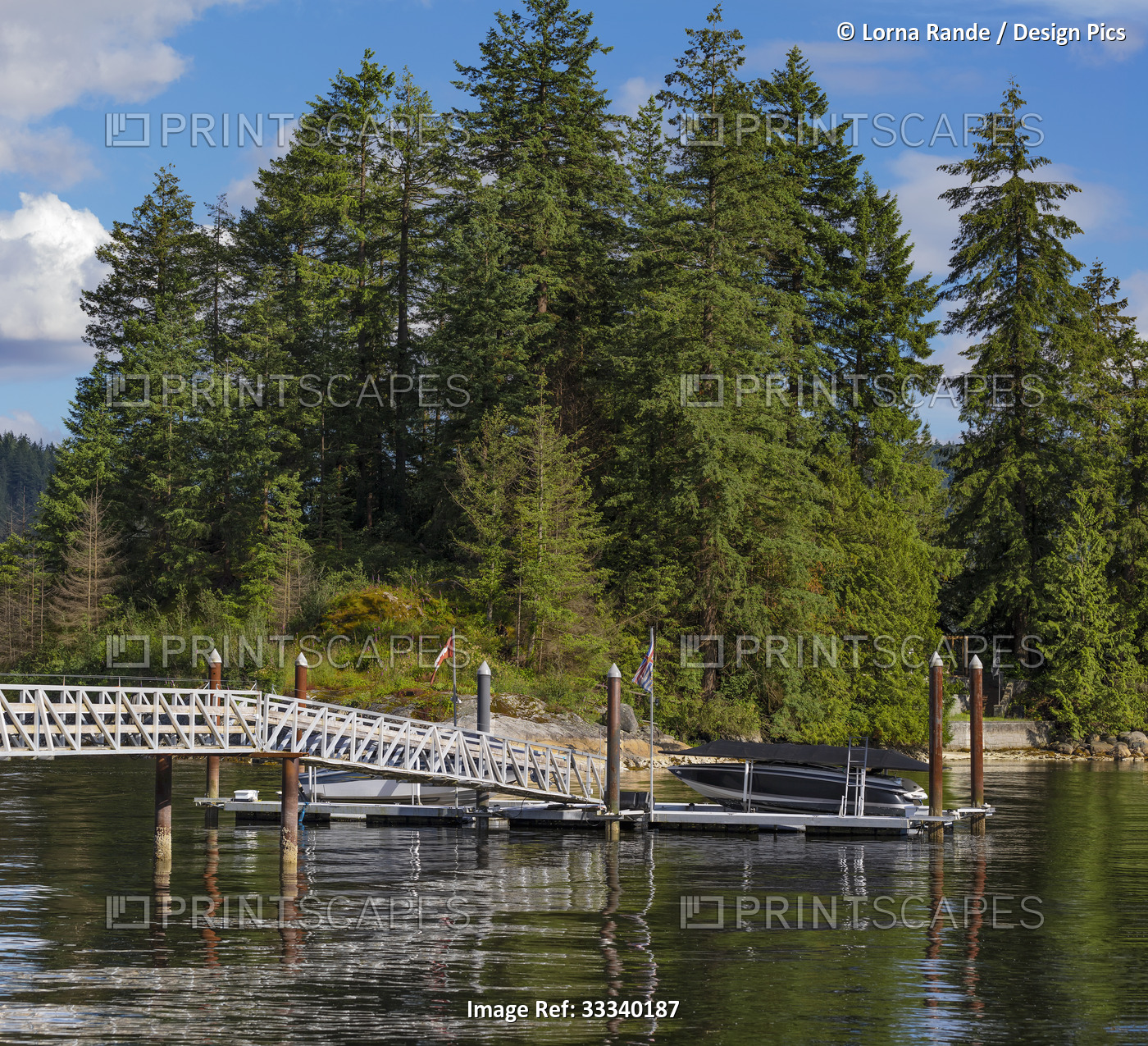 Footbridge and boats at dock in the harbor at Deep Cove; North Vancouver, ...