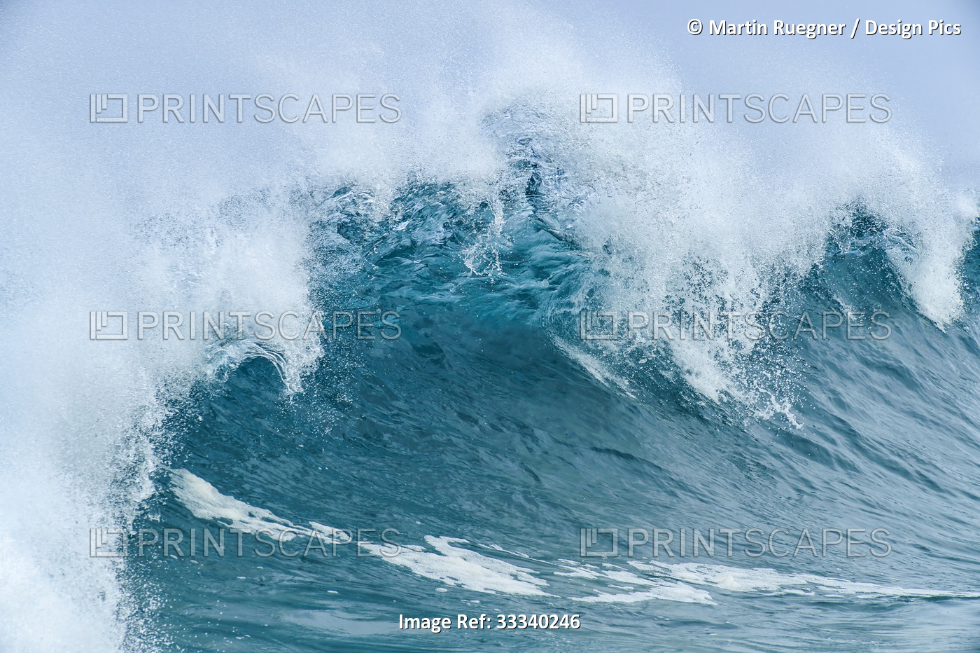 Large turquoise ocean wave cresting before reaching the shore; Oahu, Hawaii, ...