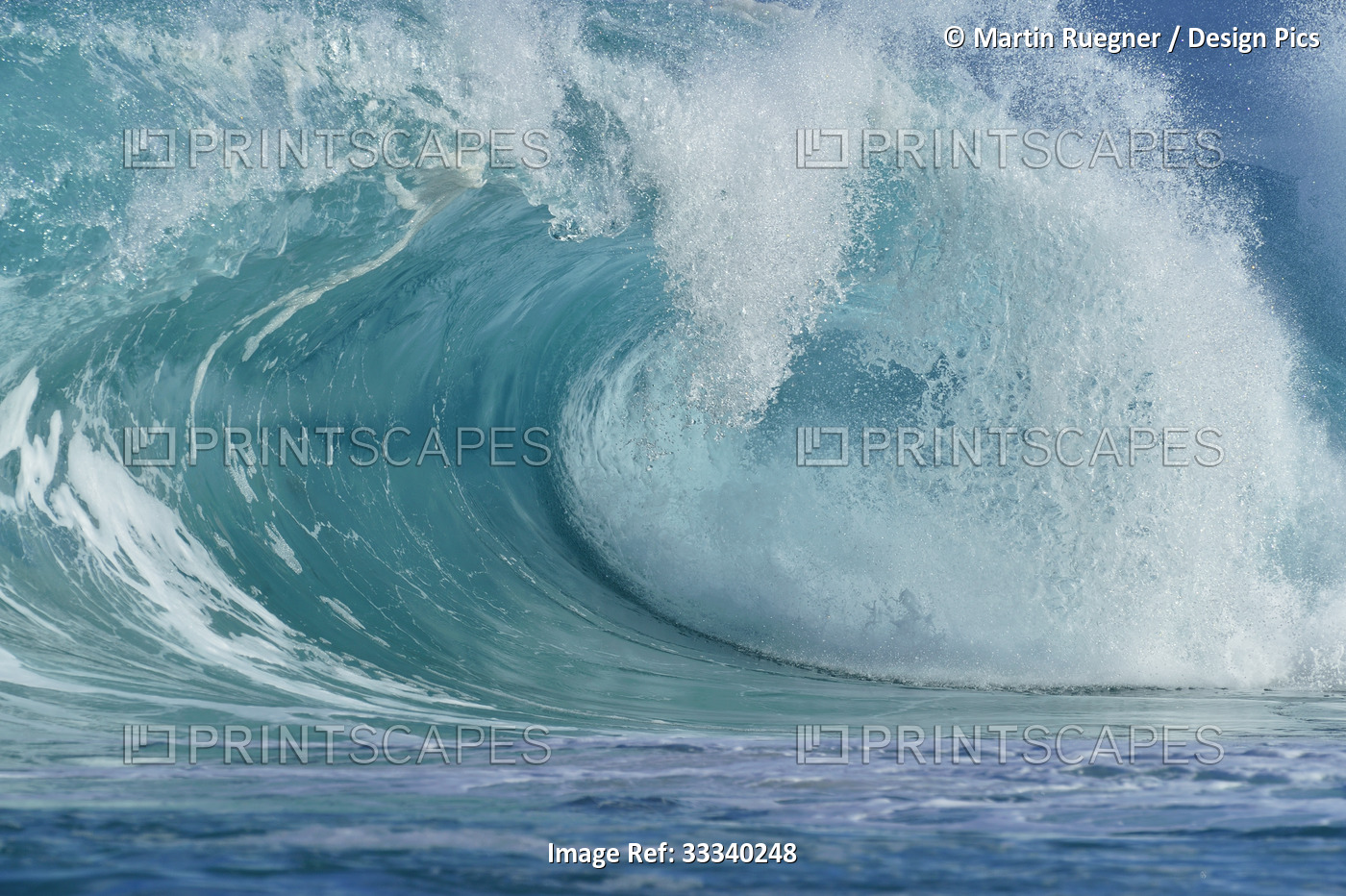 Large turquoise ocean wave cresting before reaching the shore; Oahu, Hawaii, ...