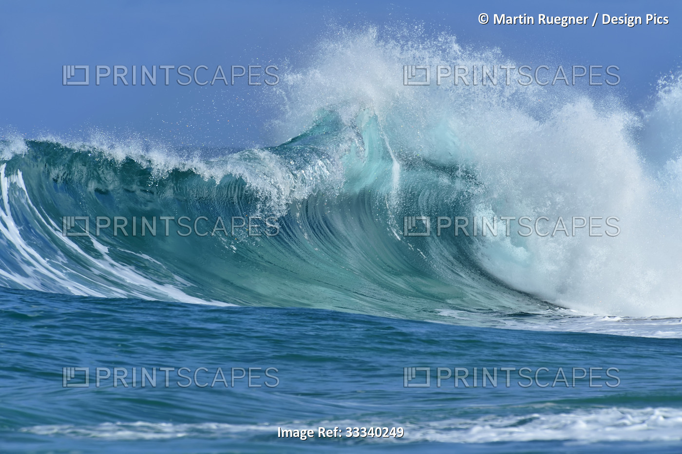 Close-up of turquoise ocean wave breaking with frothy spray; Oahu, Hawaii, ...