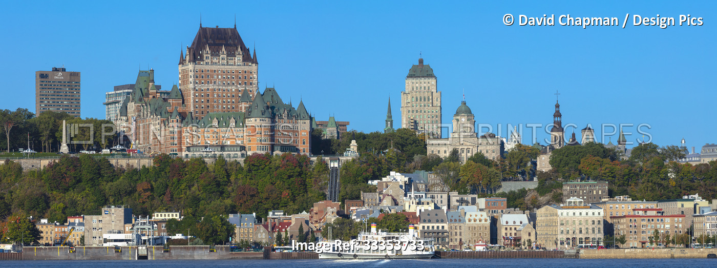 Quebec City skyline and Chateau Frontenac with a boat on the Saint Lawrence ...