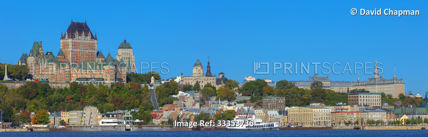 Quebec City skyline and Chateau Frontenac with a boat on the Saint Lawrence ...