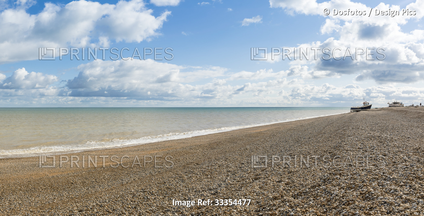 View of the shoreline along the Atlantic Ocean at Dungeness shingle beach on a ...