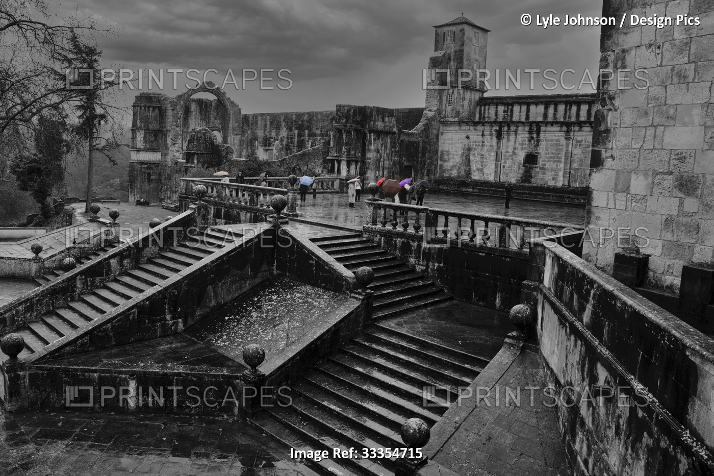 Tourists at Convent of Christ in black and white with colourized umbrellas; ...