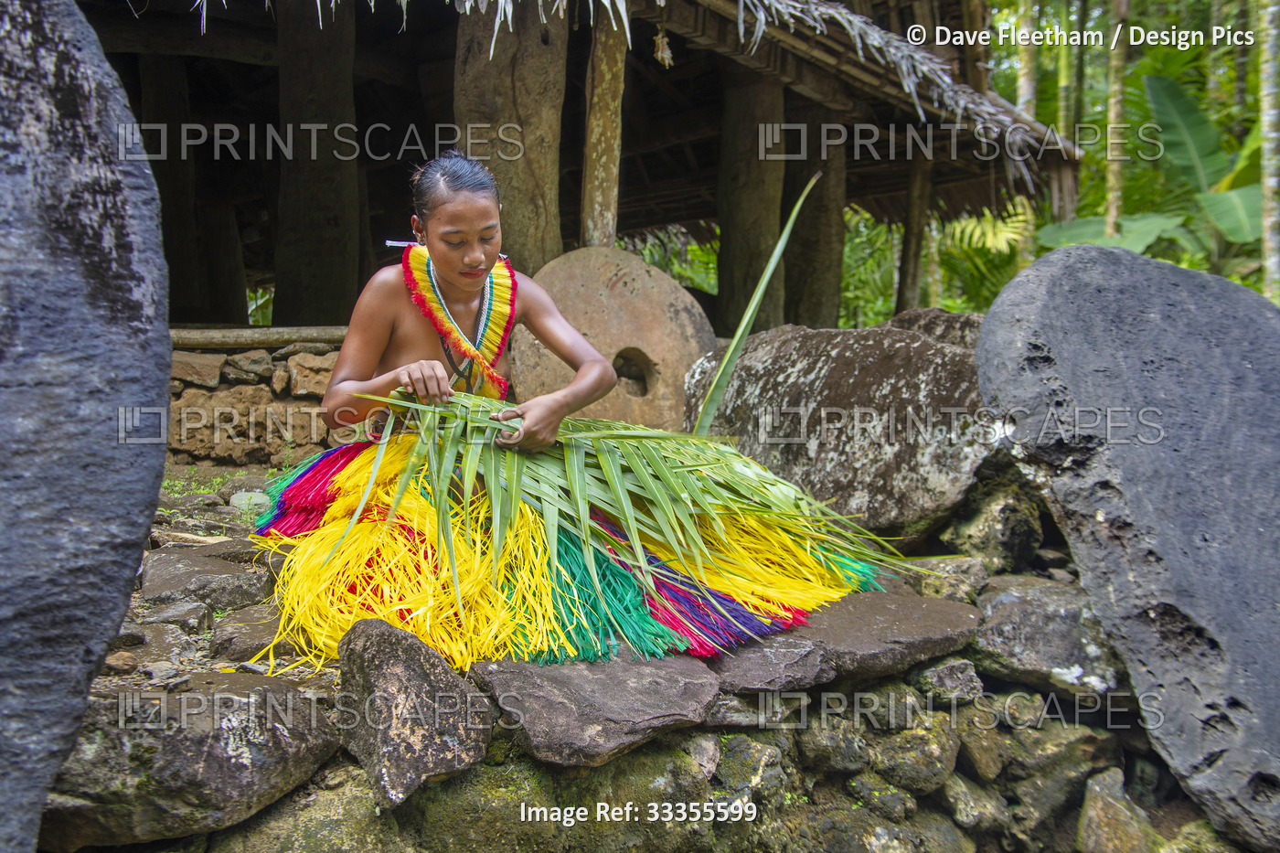 This young woman is in a traditional outfit for cultural ceremonies and is ...