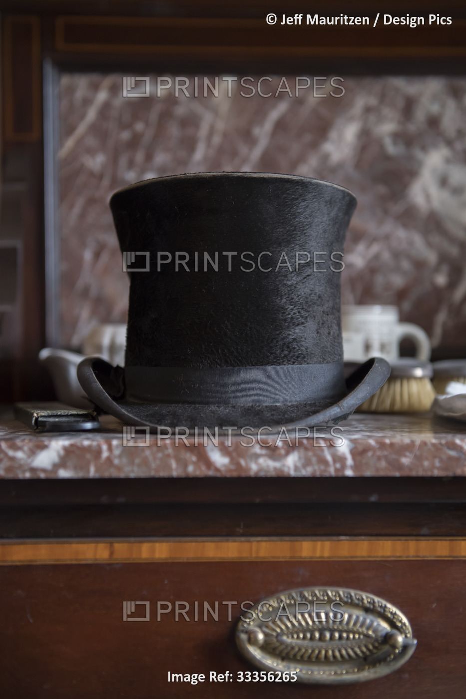 Close-up of a top hat resting on a marble tabletop in one of the bedrooms in ...