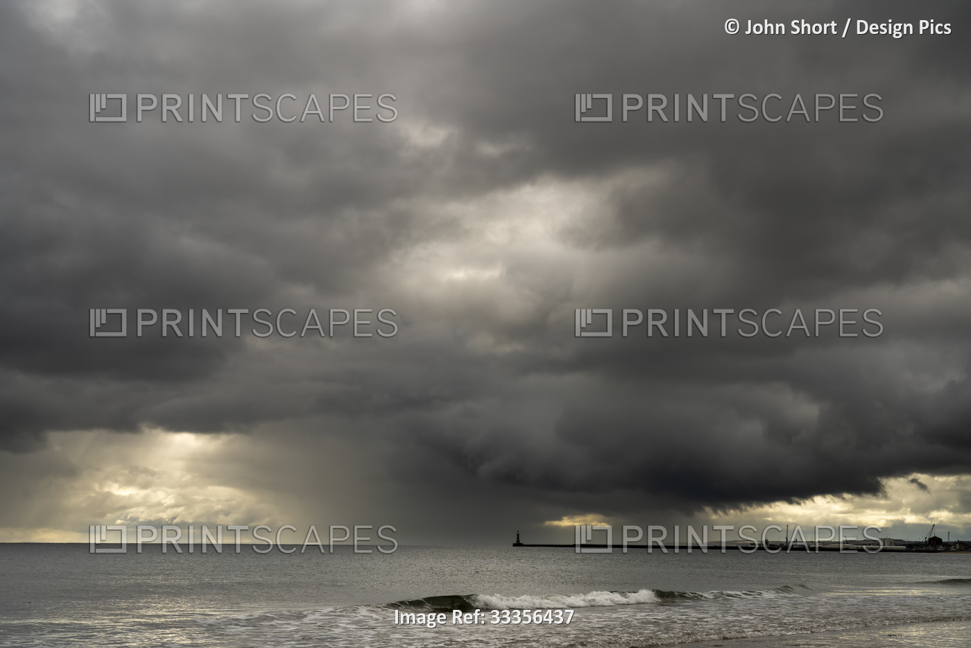Threatening storm clouds over the ocean and coastline; Sunderland, Tyne and ...