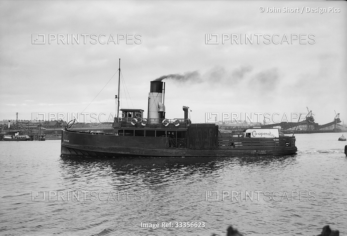 Jarrow Ferry A.B. Govan on the River Tyne with cars and people on board and a ...