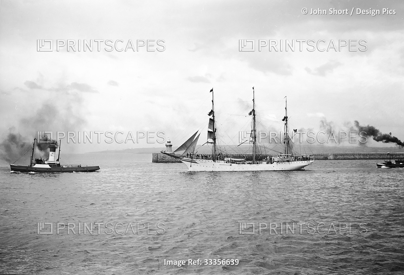 Sailing ship leaving the River Tyne towed by a tug and guided by pilot boat, ...
