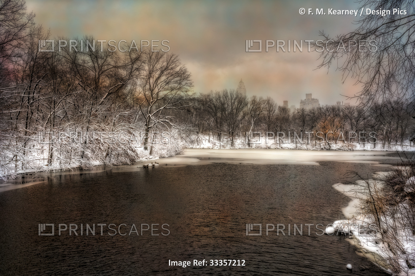 The Lake partially frozen in winter in Central Park; New York City, New York, ...