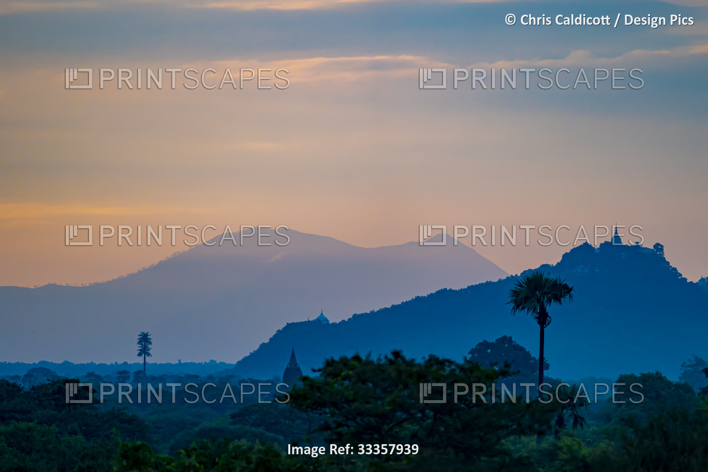 Silhouette of the mountains and pagodas with first light of sunrise over the ...