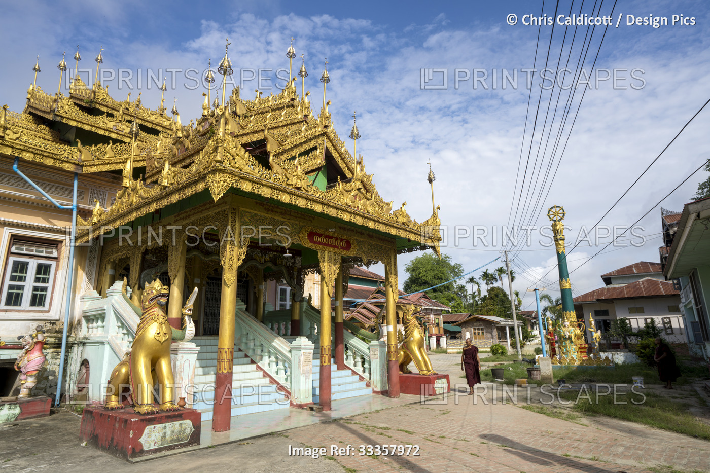Monk in the monastery and pagodas on Shwe Paw Island on Irrawaddy river, ...
