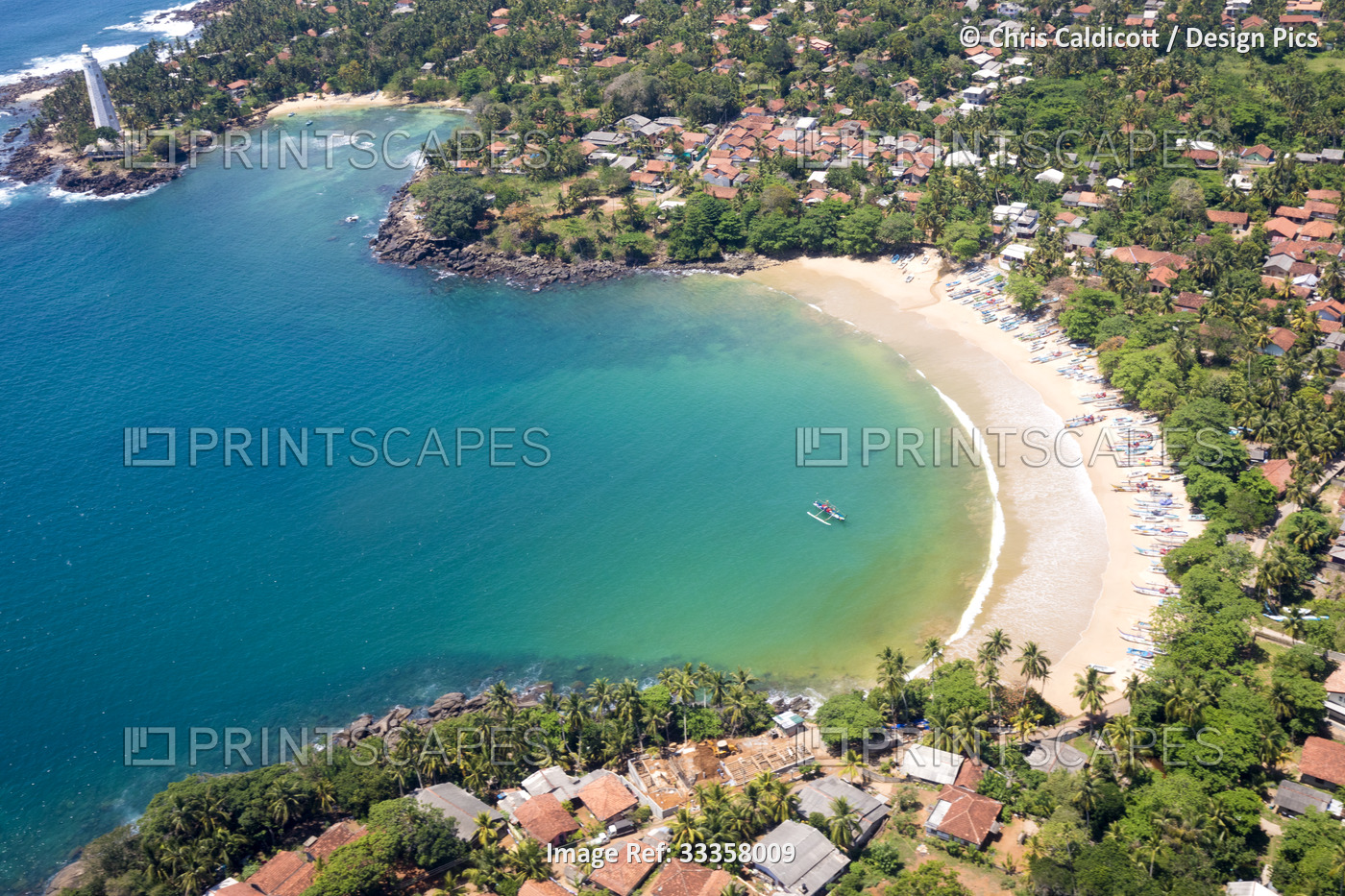 Aerial view of the rooftops of buildings surrounding the bay with a lighthouse ...