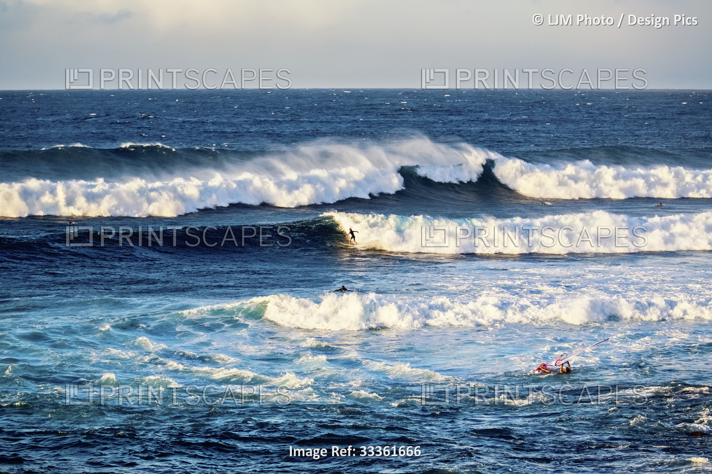 Surfing and windsurfing at Ho'okipa Beach Park near Paia; Maui, Hawaii, United ...