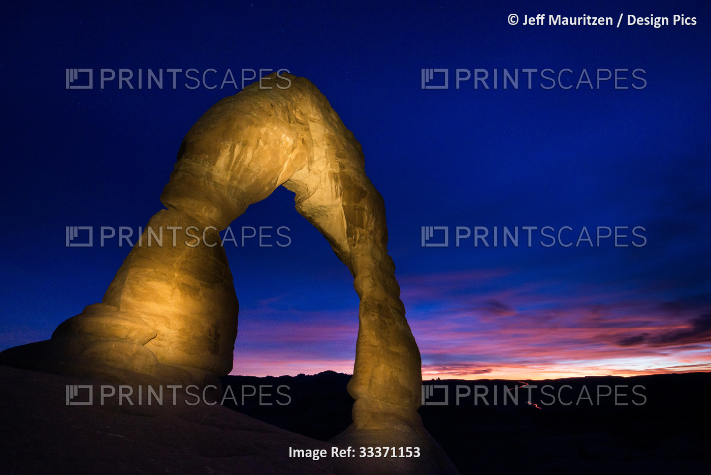 Sunset at Delicate Arch, located in Arches National Park, Utah.