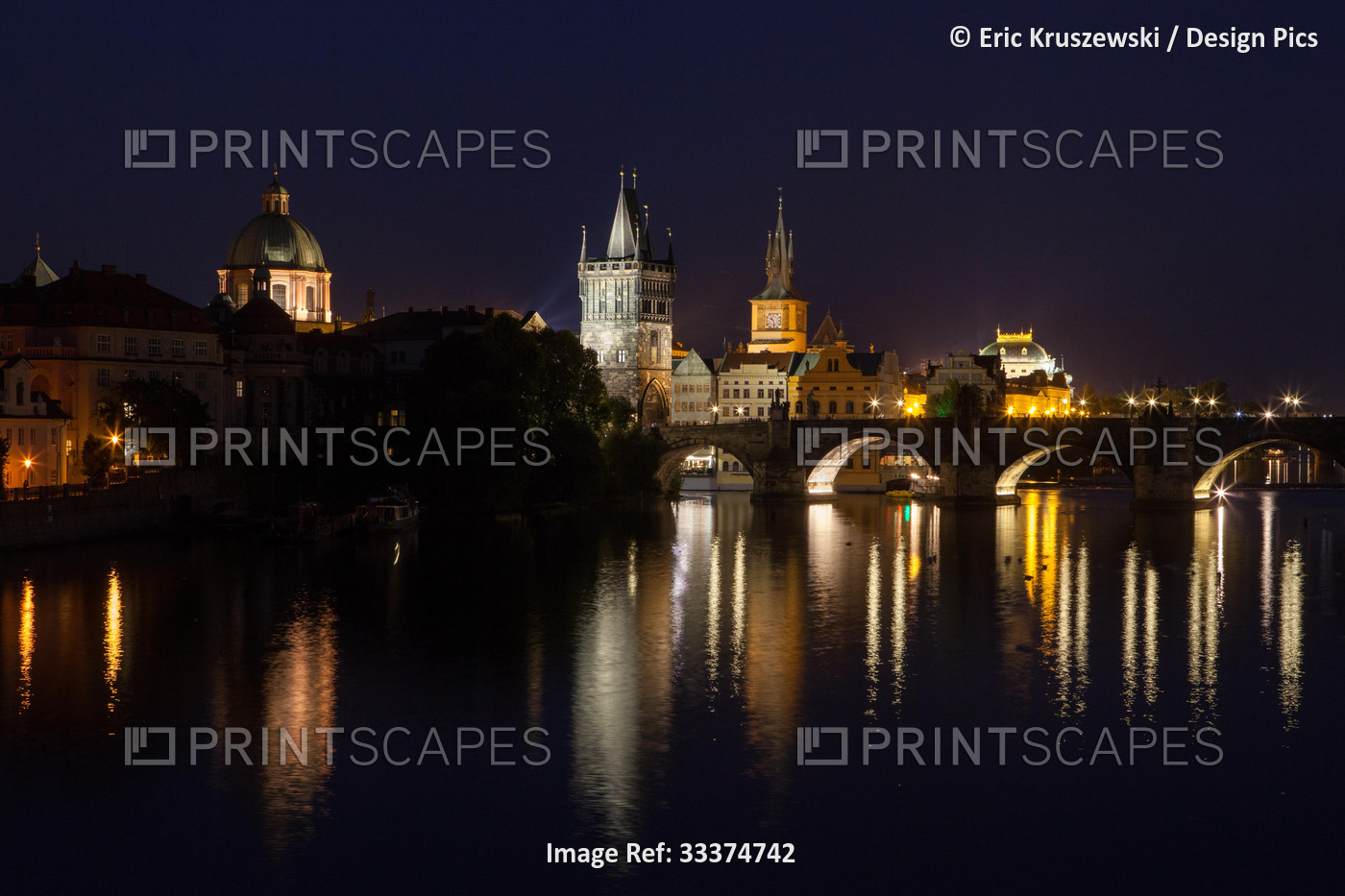 A view of the Vltava River, Charles Bridge and Prague Old Town at night.; ...