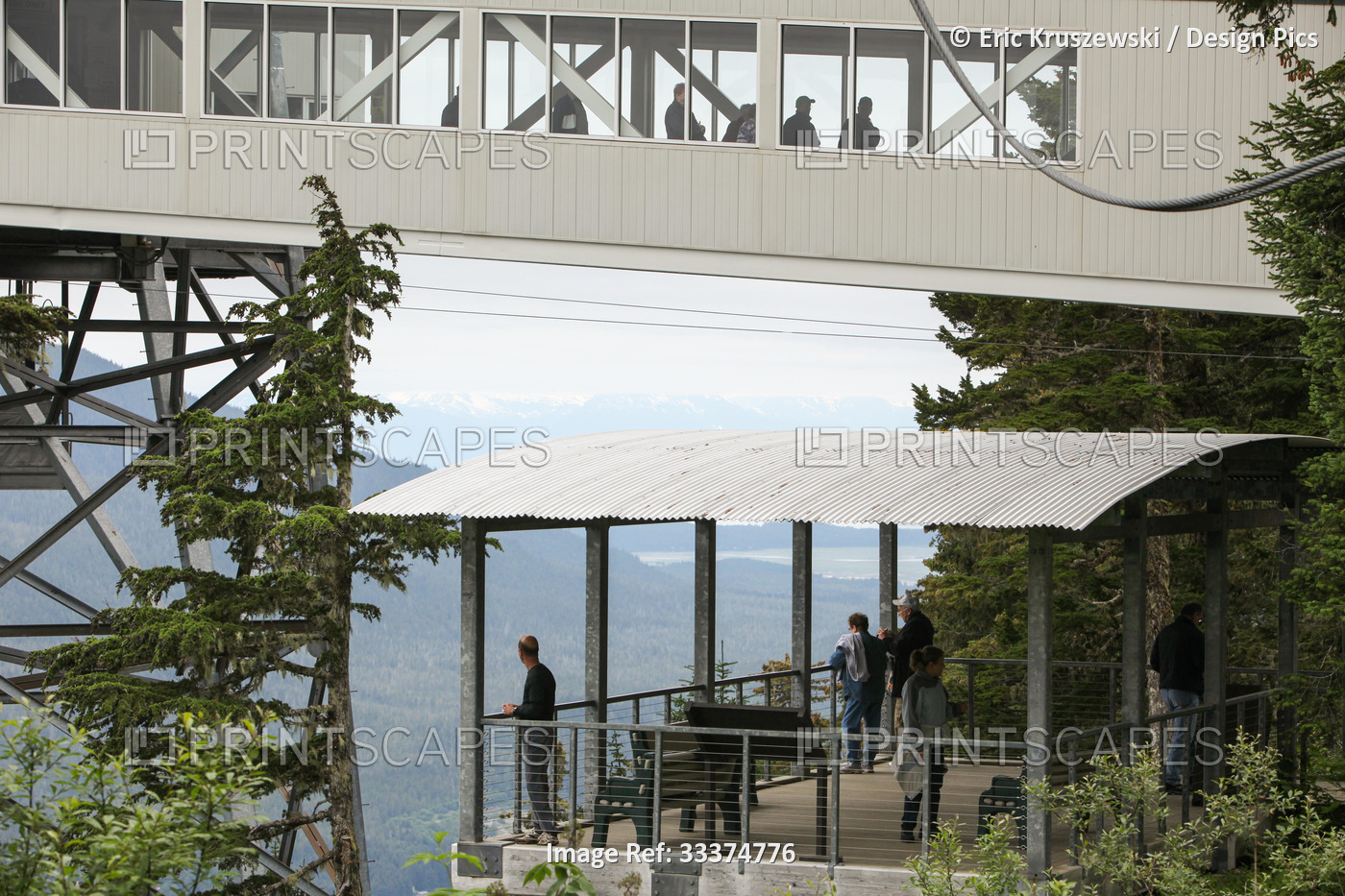 Passengers exit Mount Roberts Tramway while others observe the landscape.; ...
