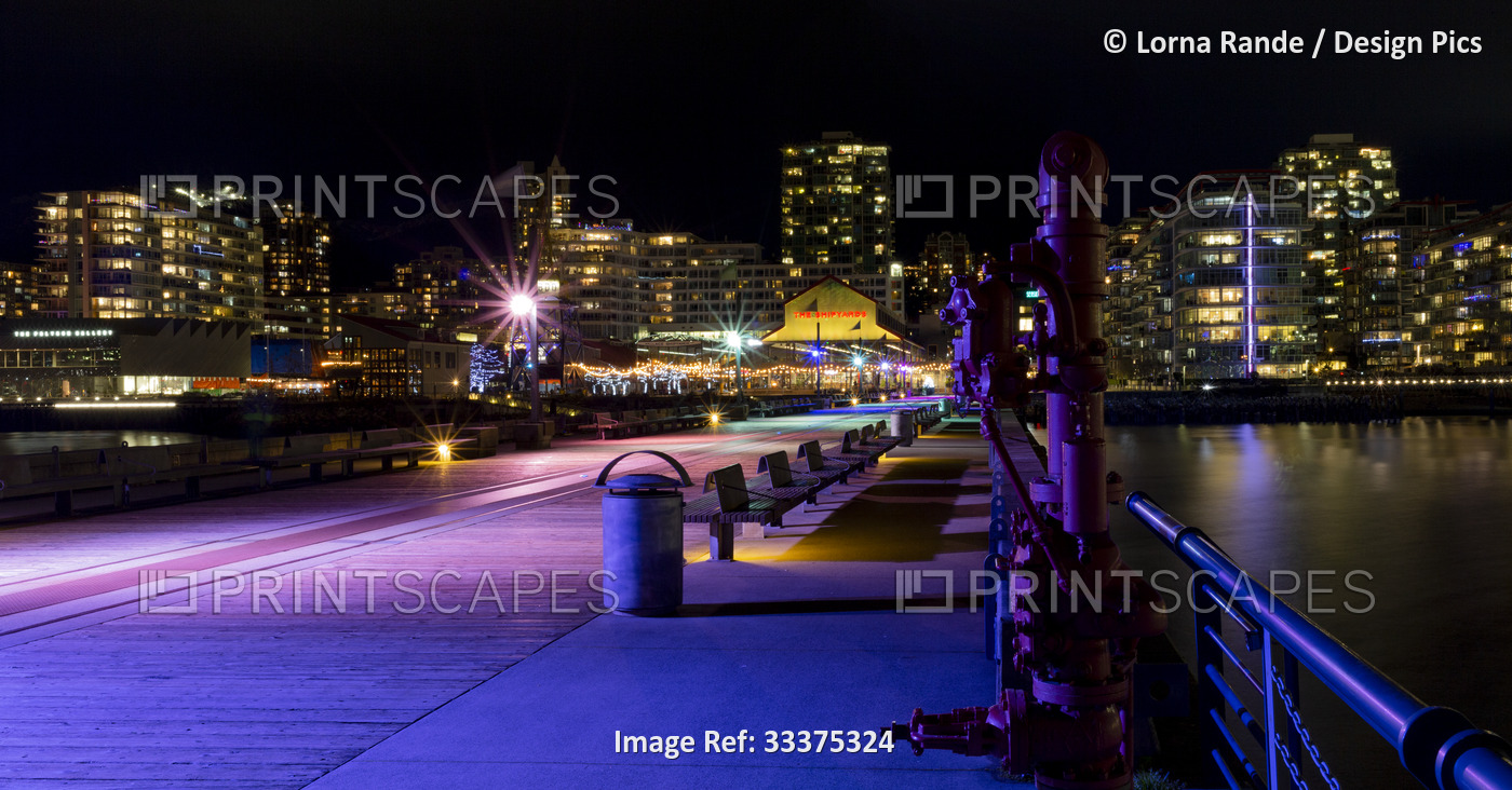 Lonsdale Quay illuminated with colourful lights at night; North Vancouver, ...