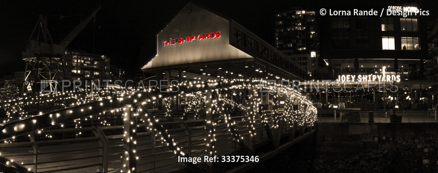 Night lights at the Shipyards restaurant at Lonsdale Quay; North Vancouver, ...