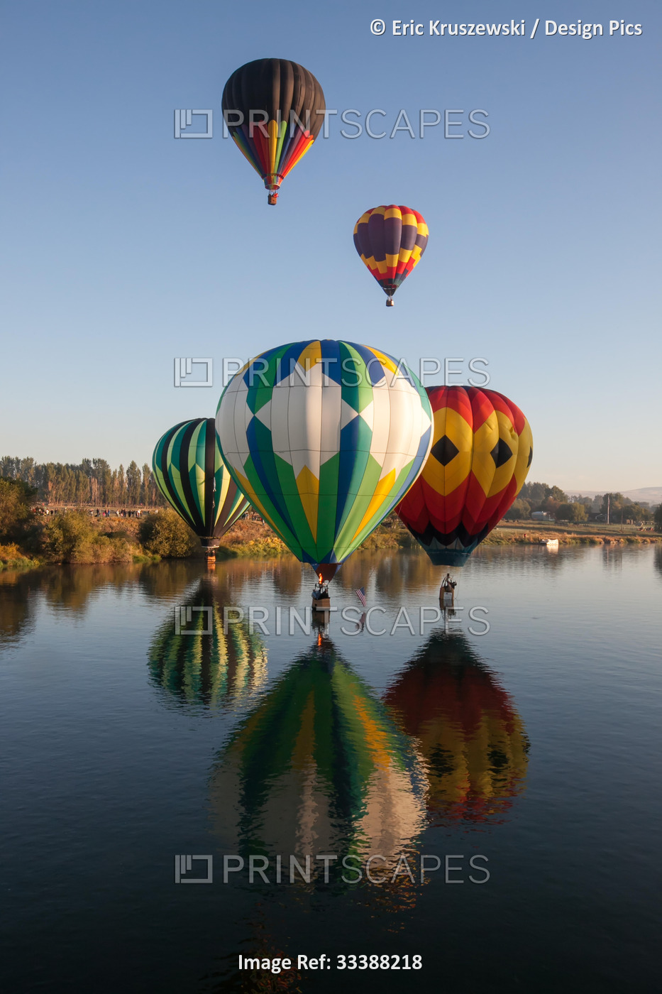 Hot air balloons from the Prosser Balloon Rally float above, and on, the water ...
