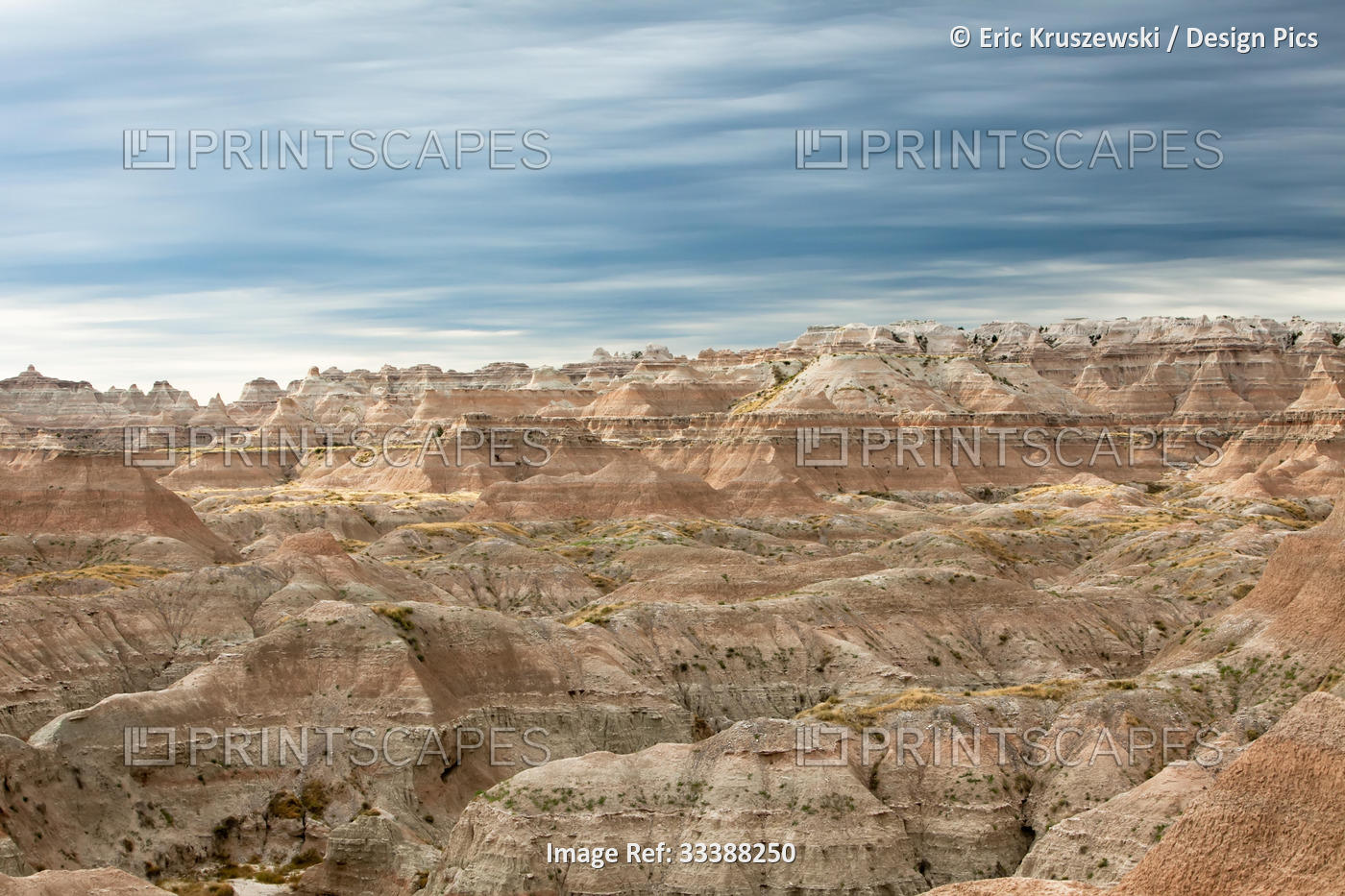 Cloudy skies appear above the buttes of Badlands National Park.; Badlands ...