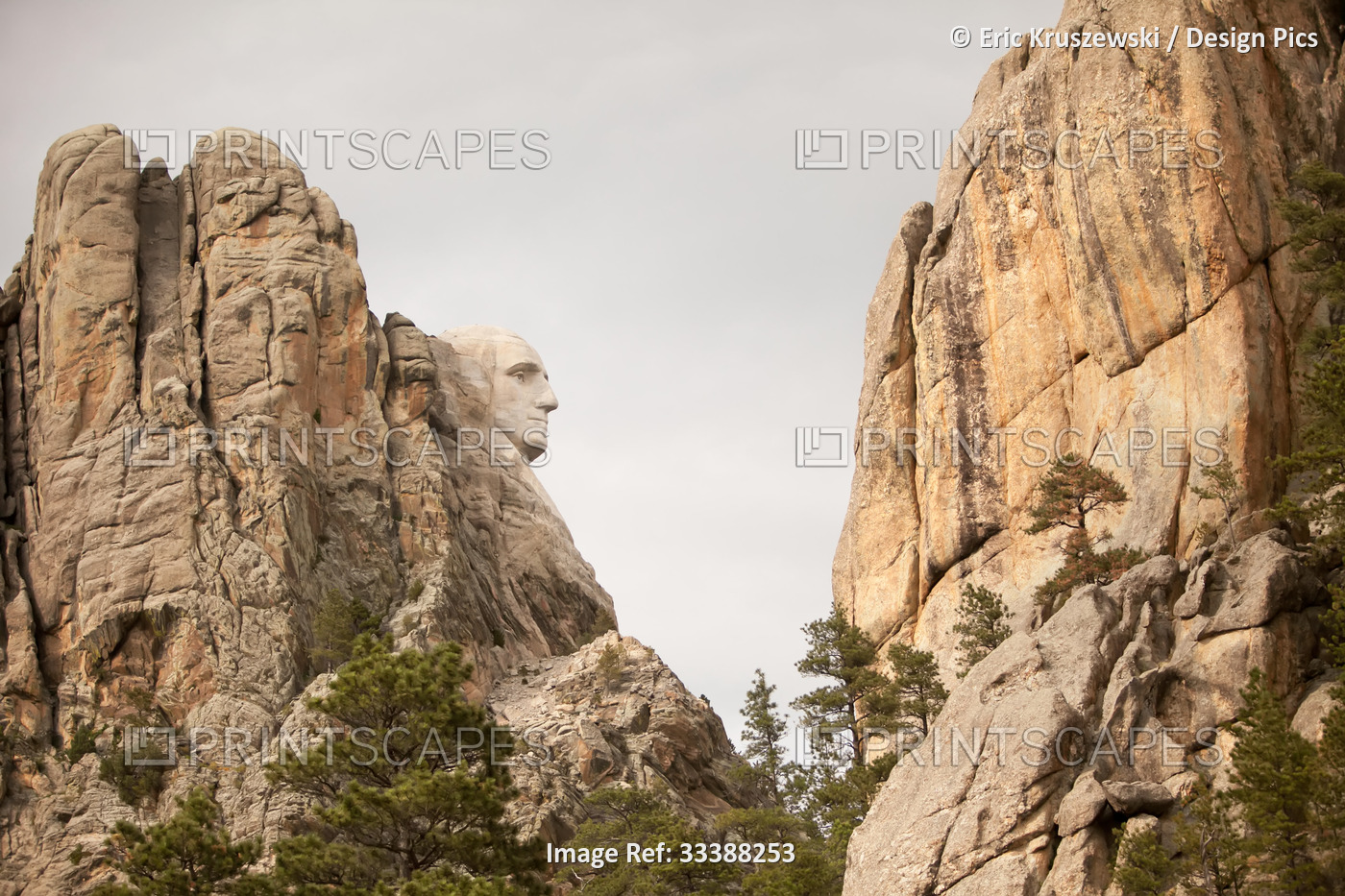 The profile of President George Washington is visible on Mount Rushmore.; Mount ...