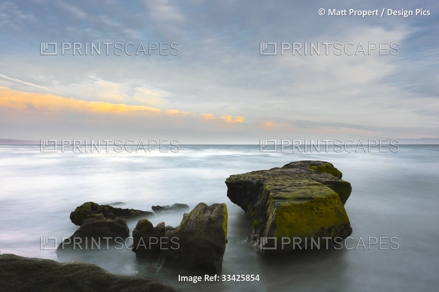 A long exposure seascape made along a rocky beach in Santa Cruz; Santa Cruz, ...