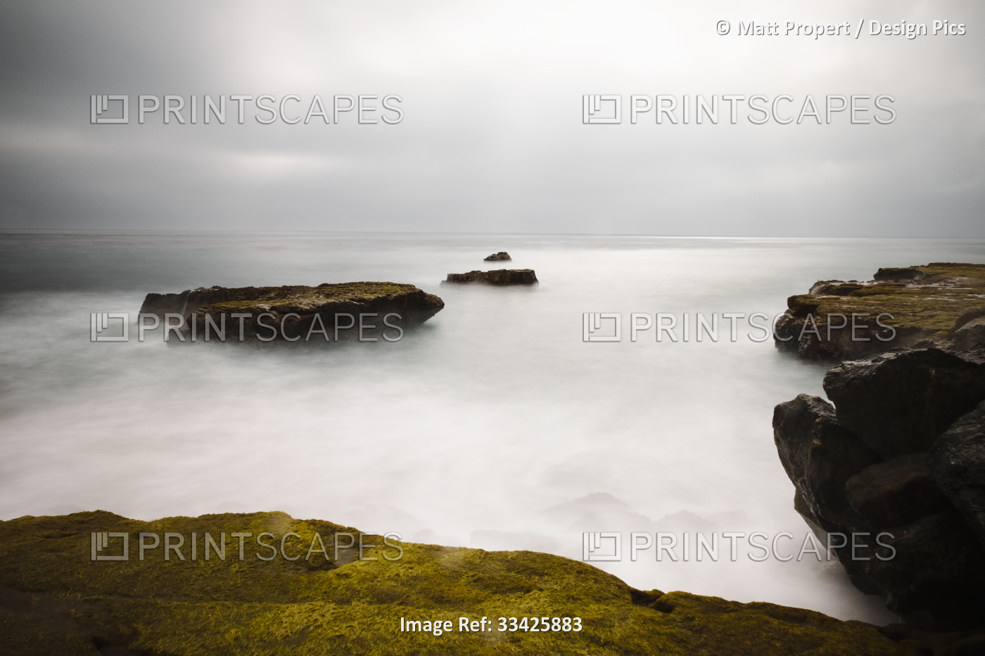 A long exposure seascape made along a rocky beach in Santa Cruz; Santa Cruz, ...