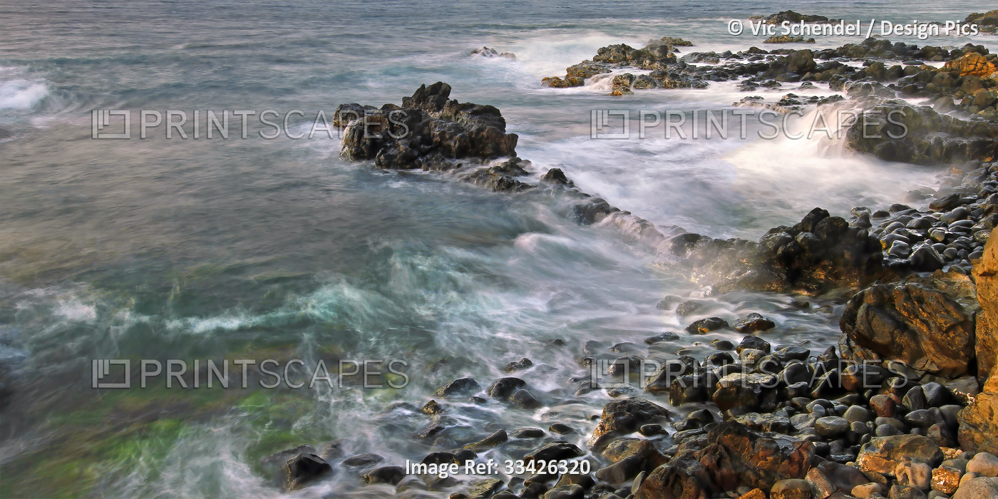 Waves against a rugged and rocky coastline of Maui, Hawaii, USA; Maui, Hawaii, ...