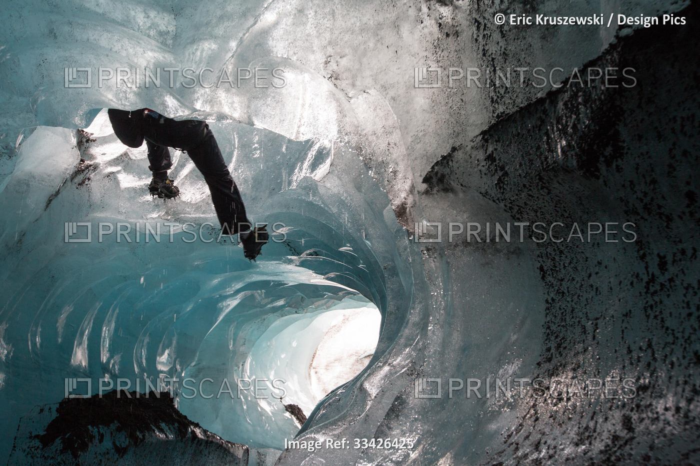A climber descends by rope into a moulin on Skaftafell Glacier.; Skaftafell ...