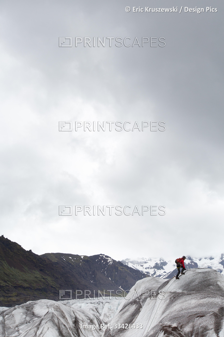 A climber uses ice axes to climb Skaftafell Glacier.; Skaftafell National Park, ...