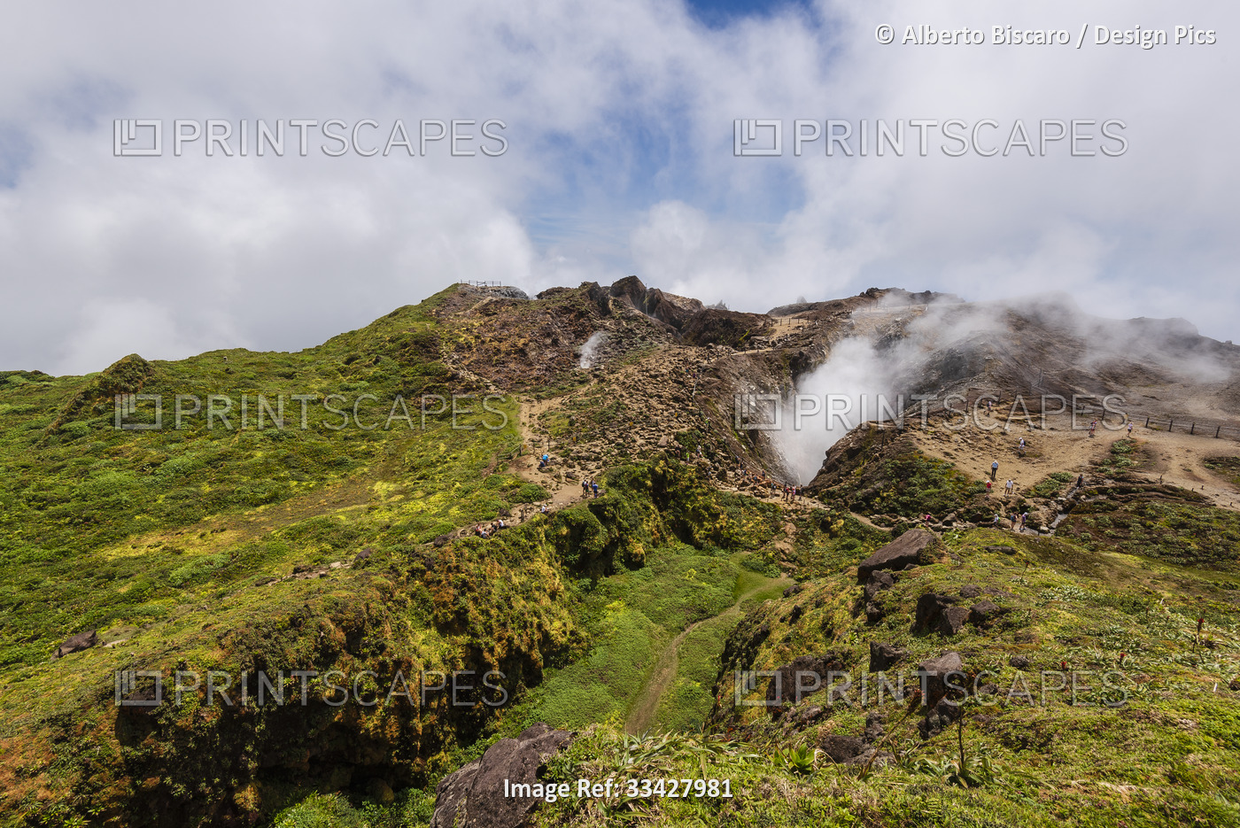 People hiking along the mountain trail near the top of the La Grande Soufriere  ...