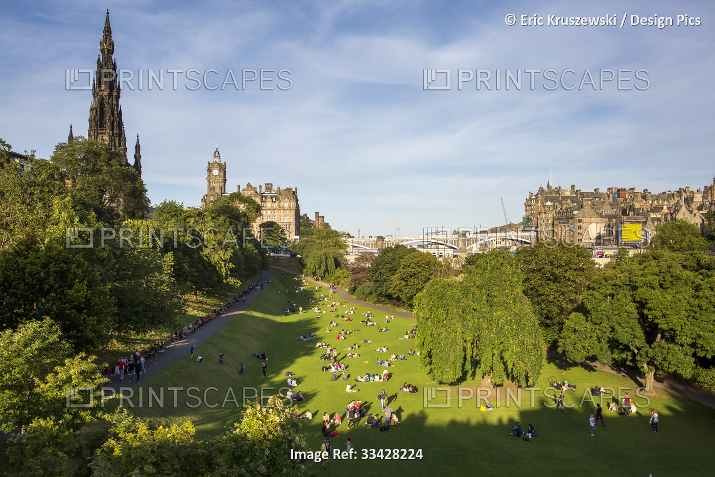 City goers sit in the Princes Street Gardens in downtown Edinburgh, Scotland; ...