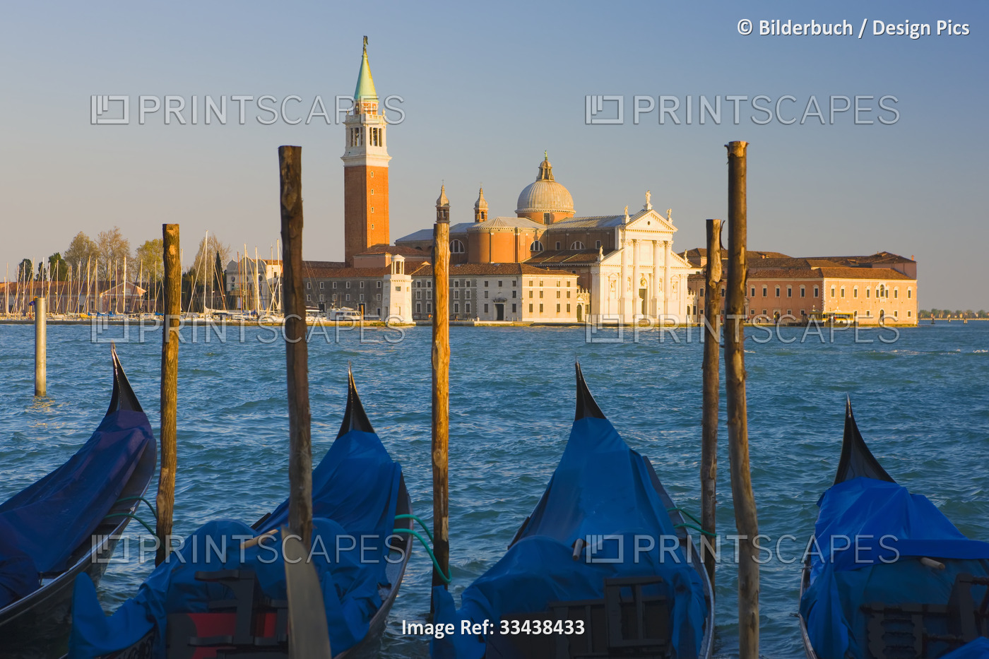 Gondolas with the church of Saint George Major in the background in Venice, ...