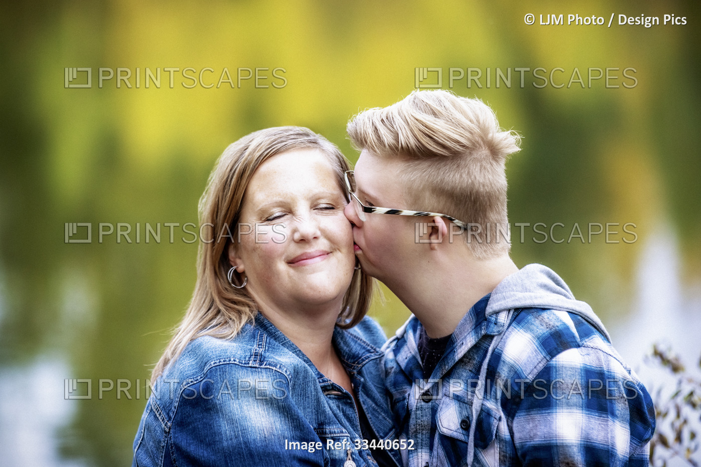 A mother and her son who has Down Syndrome spending quality time together in a ...
