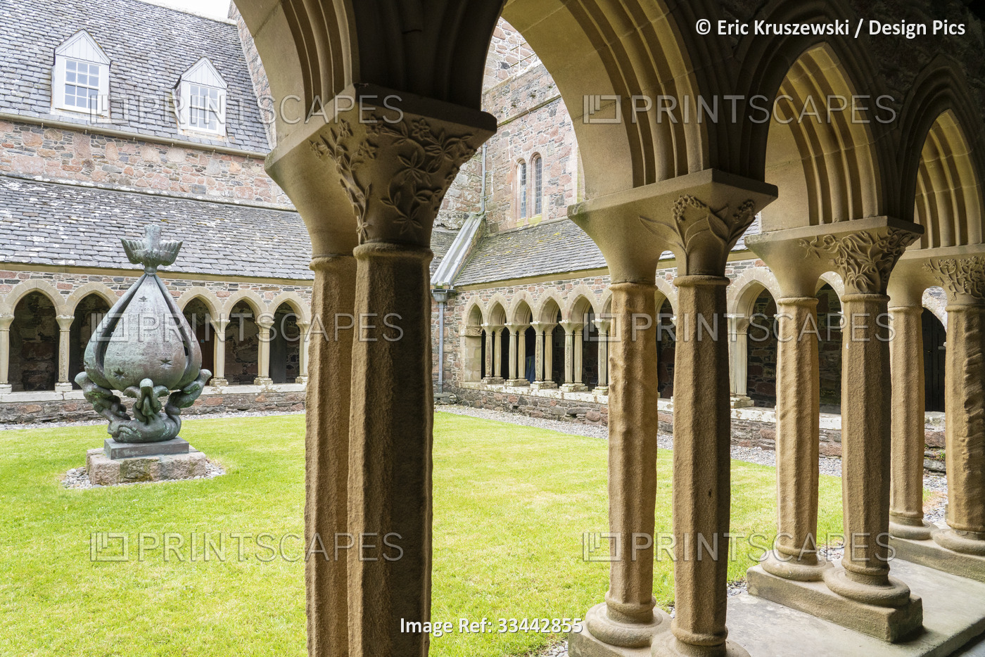 Sculptured columns line the cloisters inner courtyard of the Benedictine Abbey ...