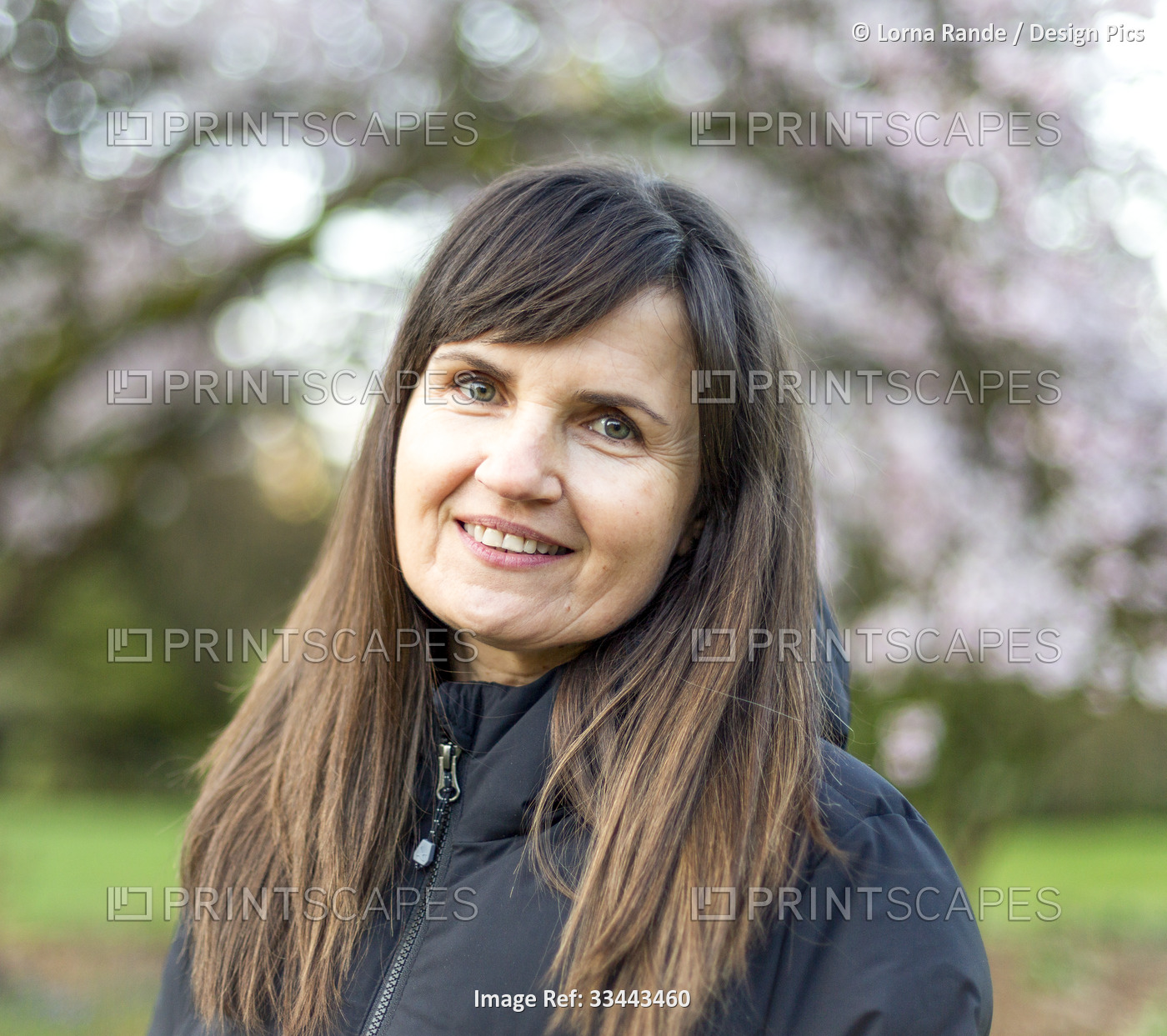 Portrait of a mature woman outdoors, Stanley Park; Vancouver, British Columbia, ...