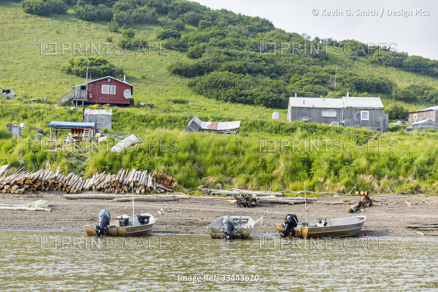 A mid-river view of three Yukon River fishing boats tied up on the beach in ...
