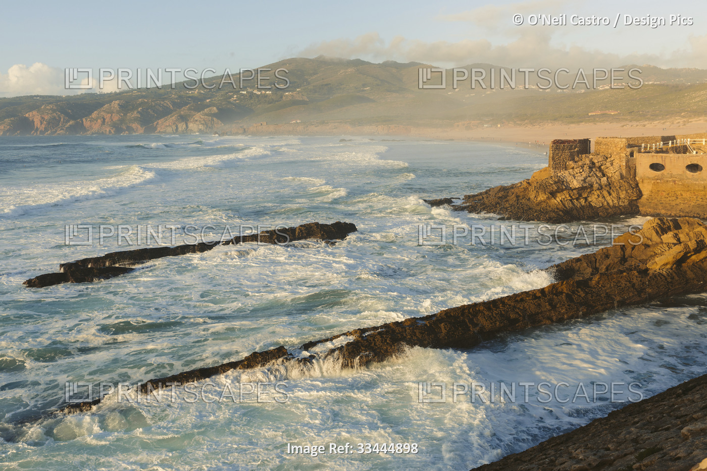 Atlantic Ocean waves along the shores of the Praia do Guincho near Cascais with ...
