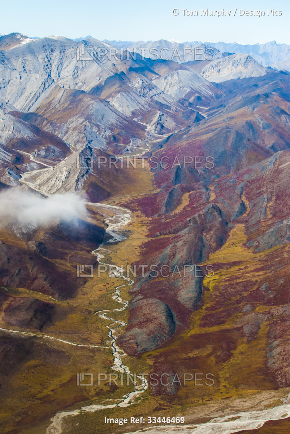Aerial view of the Kongakut River flowing through the tundra and the mountains ...