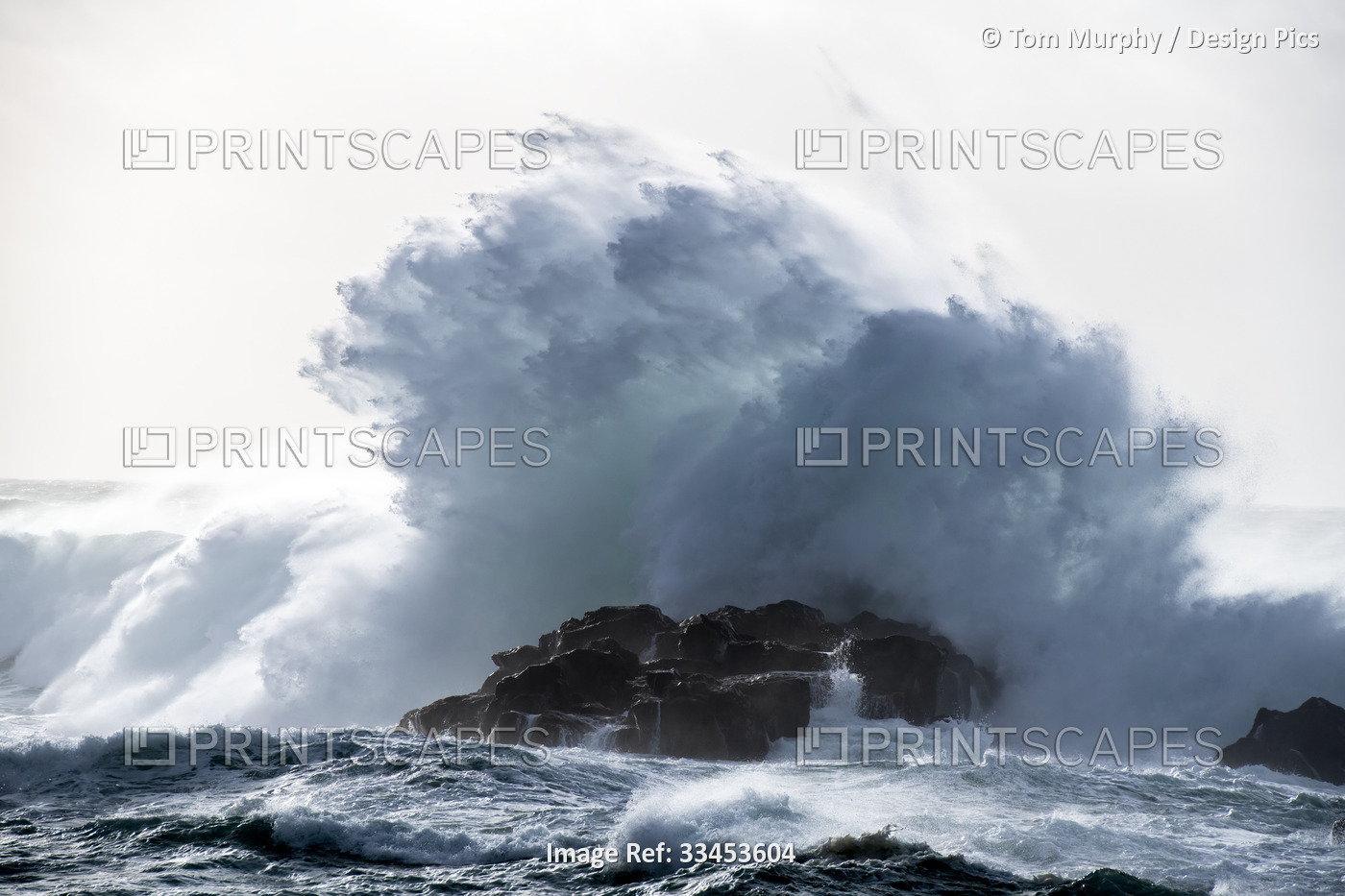 Dramatic wave crashing against the rocks along the coast of Iceland; Atlantic ...