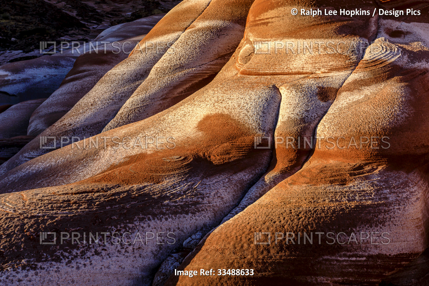 Abstract patterns of salt stains on red sandstone formations, on the Baja ...