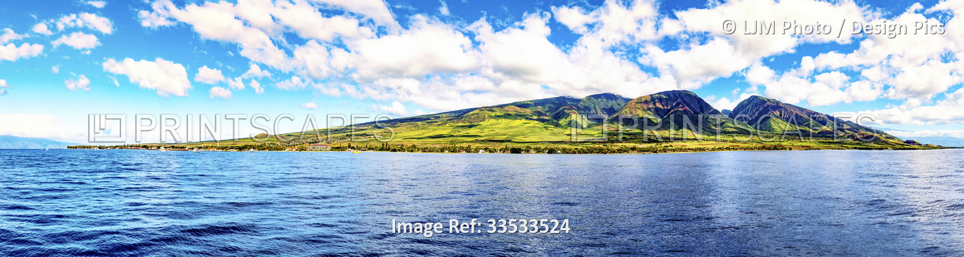 View from a boat in the ocean of the rugged coastline of South Maui in the ...
