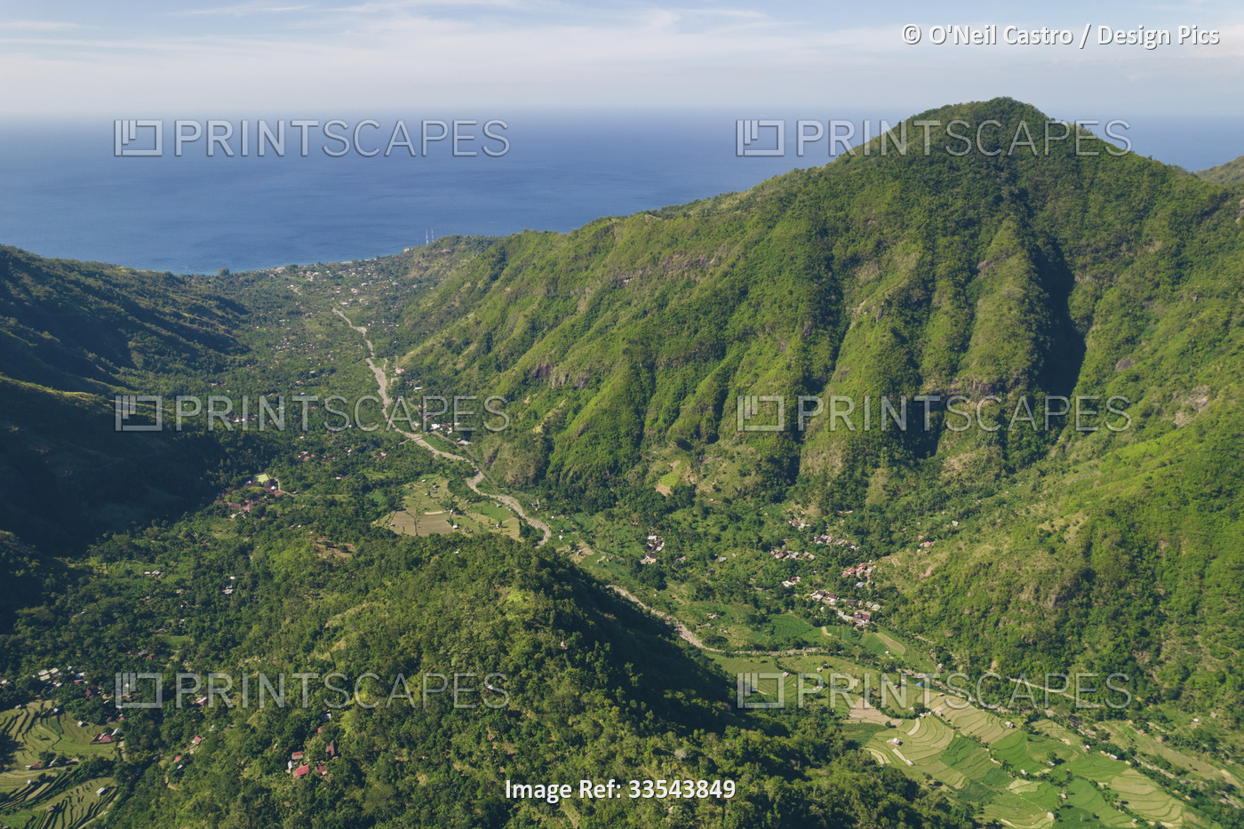 Overview of Mount Abang, with a blue, cloudy sky and lush vegetation; Abang, ...