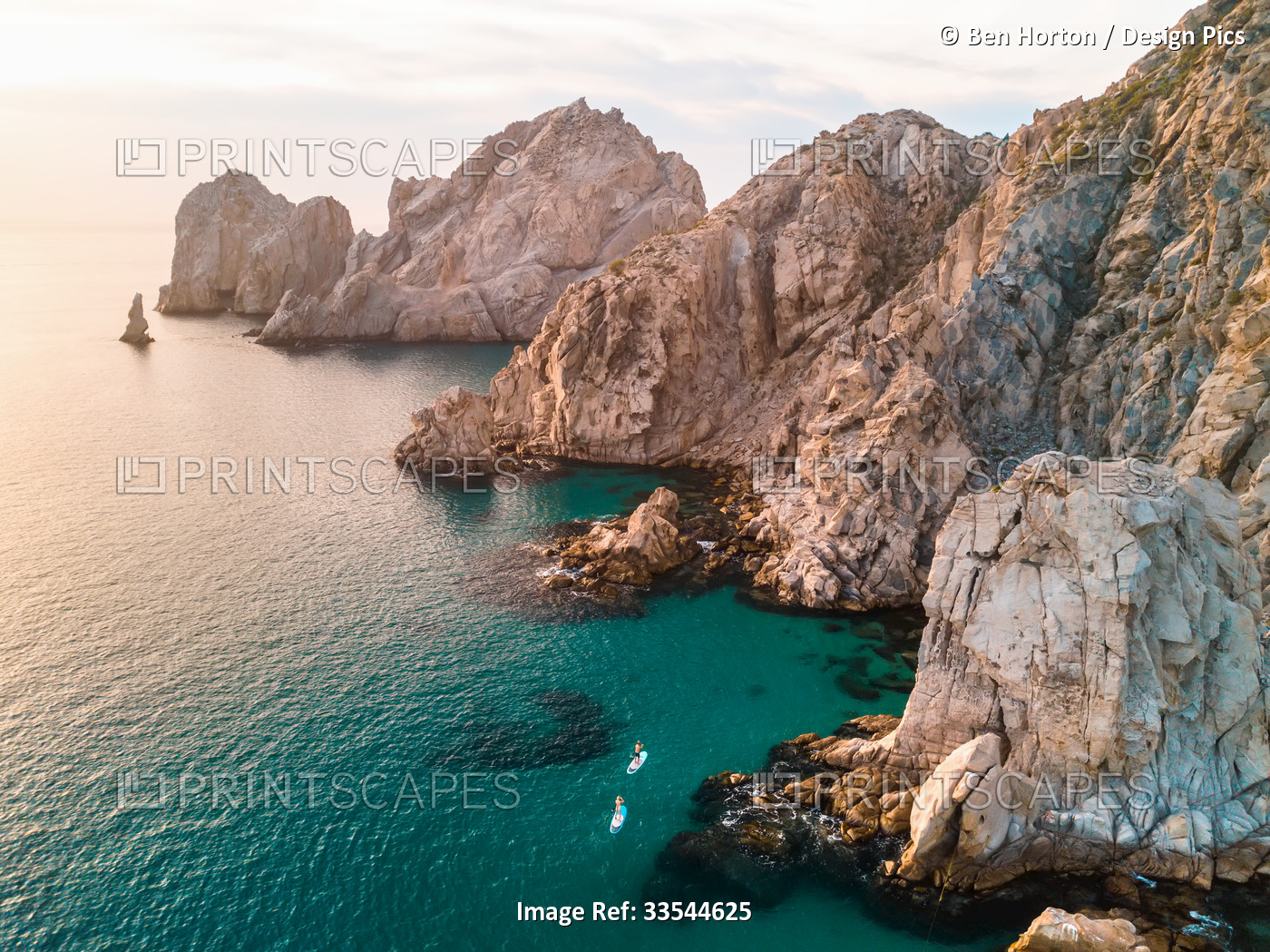 Aerial view of paddleboarders along the rocky shore on the East Cape of Cabo at ...