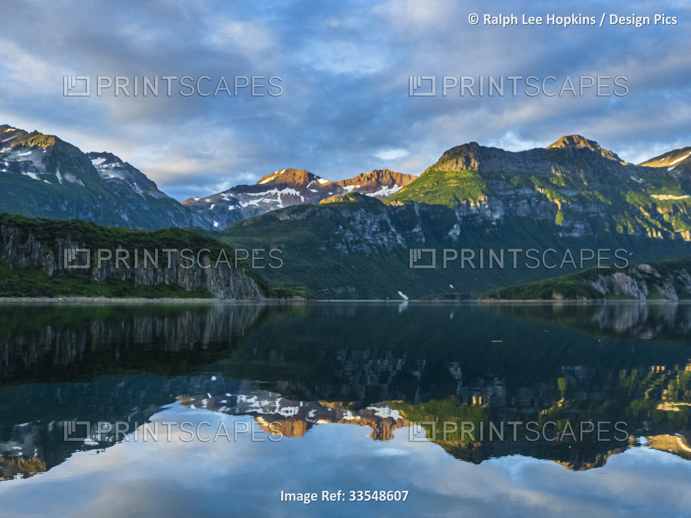 Mirror reflection of mountains at sunset in Geographic Harbor; Katmai National ...
