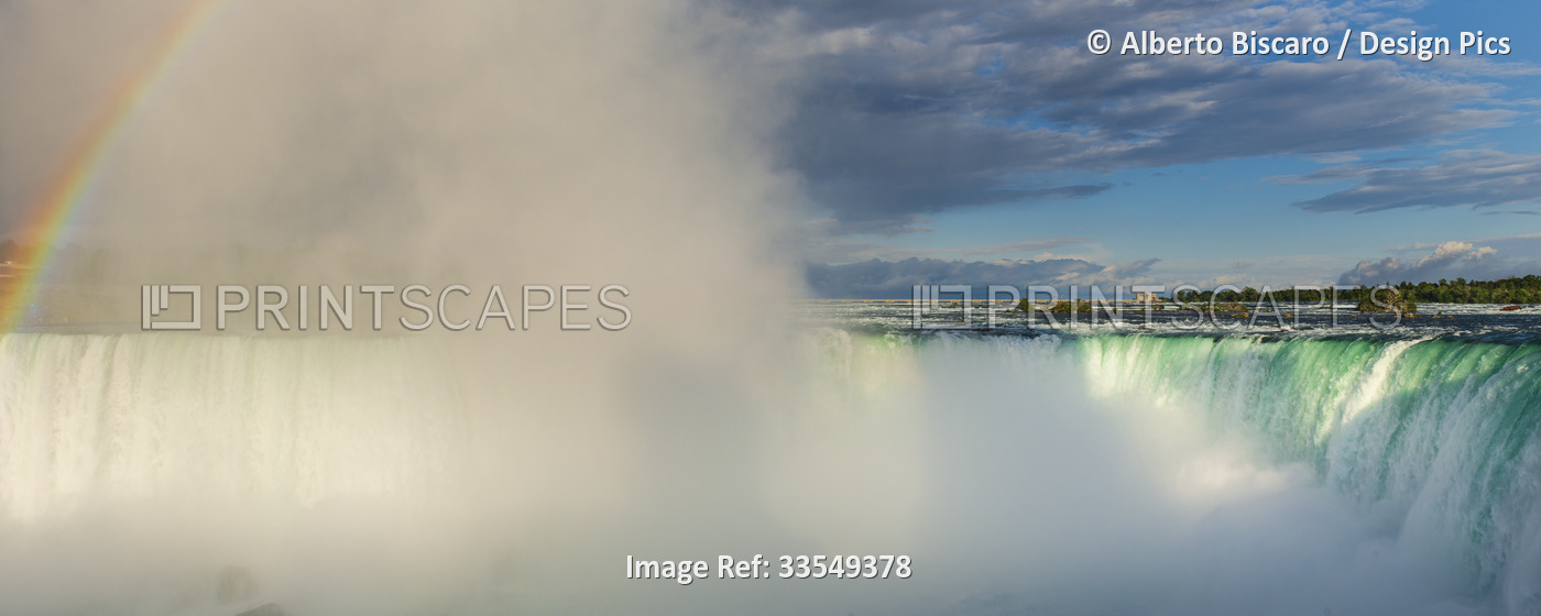 Mist spraying from the flowing Horseshoe Falls, Niagara Falls in Canada; ...