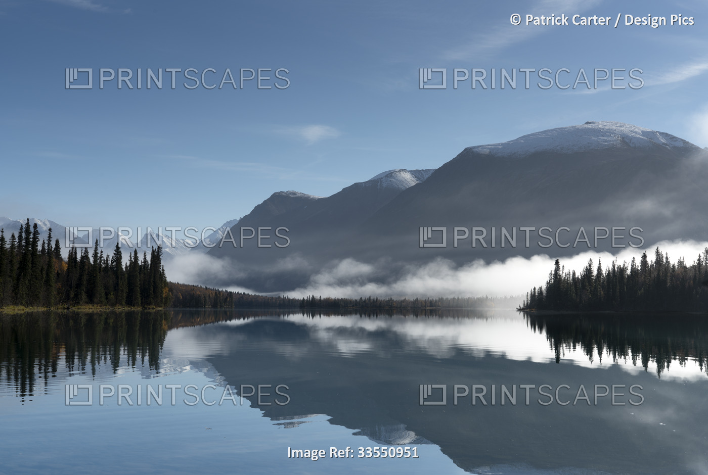 Silhouetted mountains reflected in the calm water of Kontrashibuna Lake in Lake ...