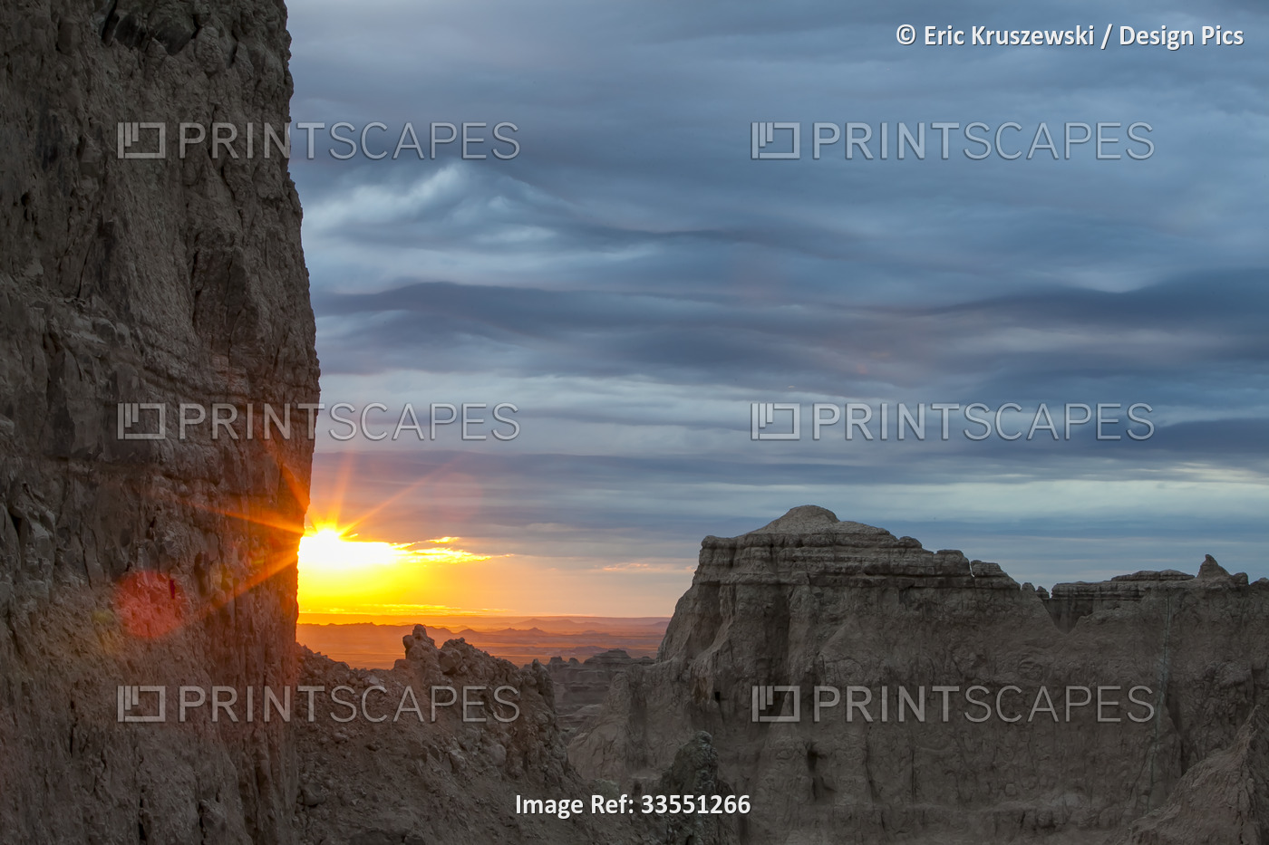 The sun rises over Badlands National Park; South Dakota, United States of ...