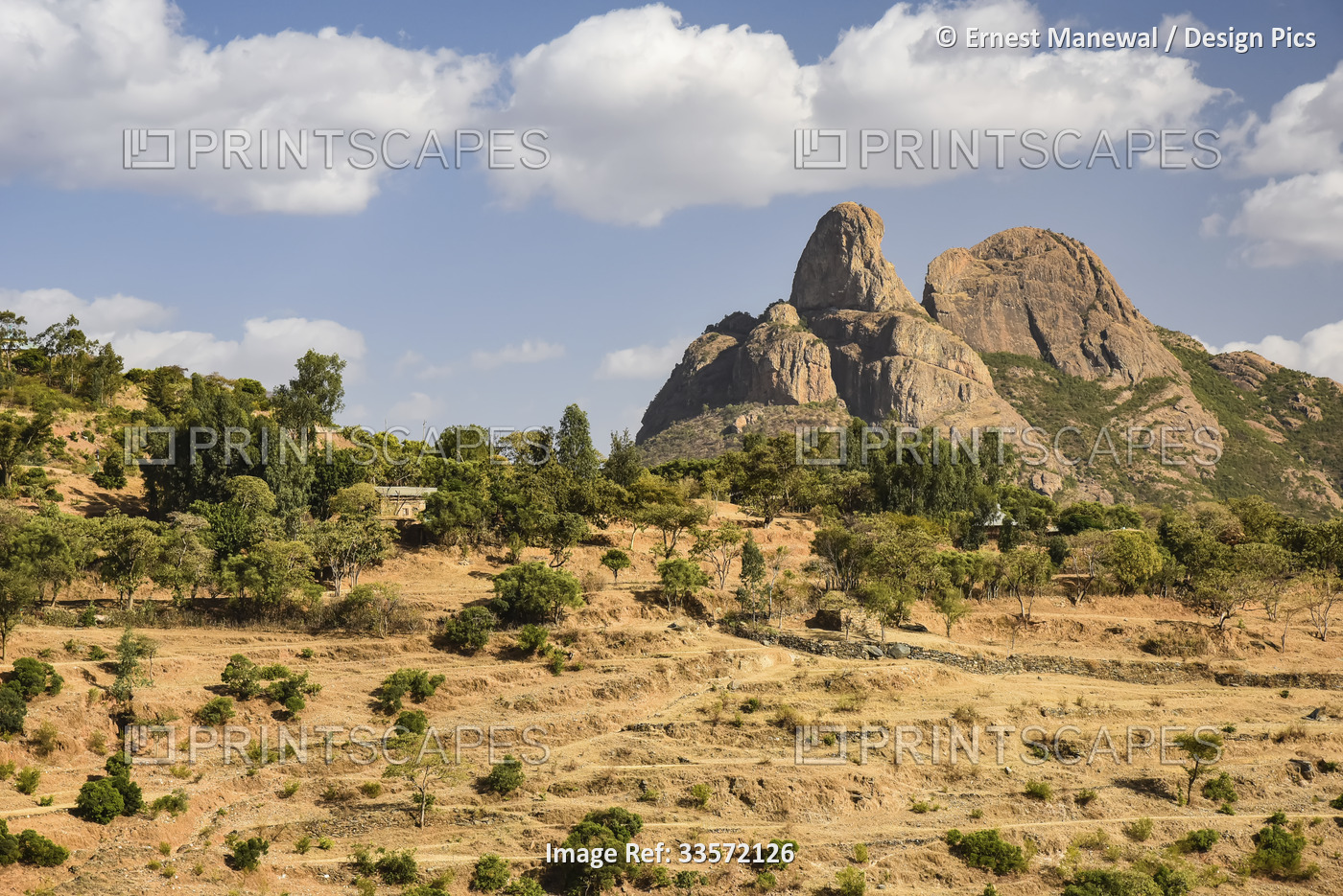 Mountainous rock formation and terraced farmland in the Ethiopian Highlands; ...